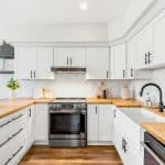 Kitchen with pot lights and stainless steel appliances