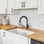 Farm sink and backsplash in kitchen