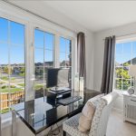Primary bedroom overlooking backyard